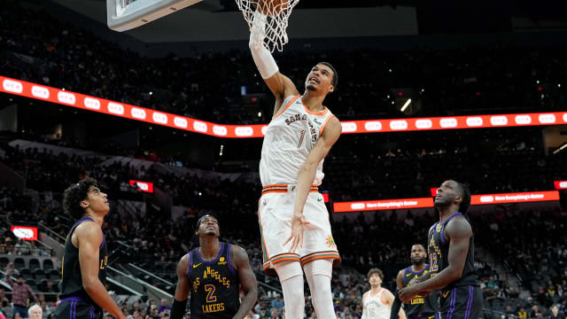 Dec 15, 2023; San Antonio, Texas, USA; San Antonio Spurs forward Victor Wembanyama (1) dunks during the first half against the Los Angeles Lakers at Frost Bank Center.